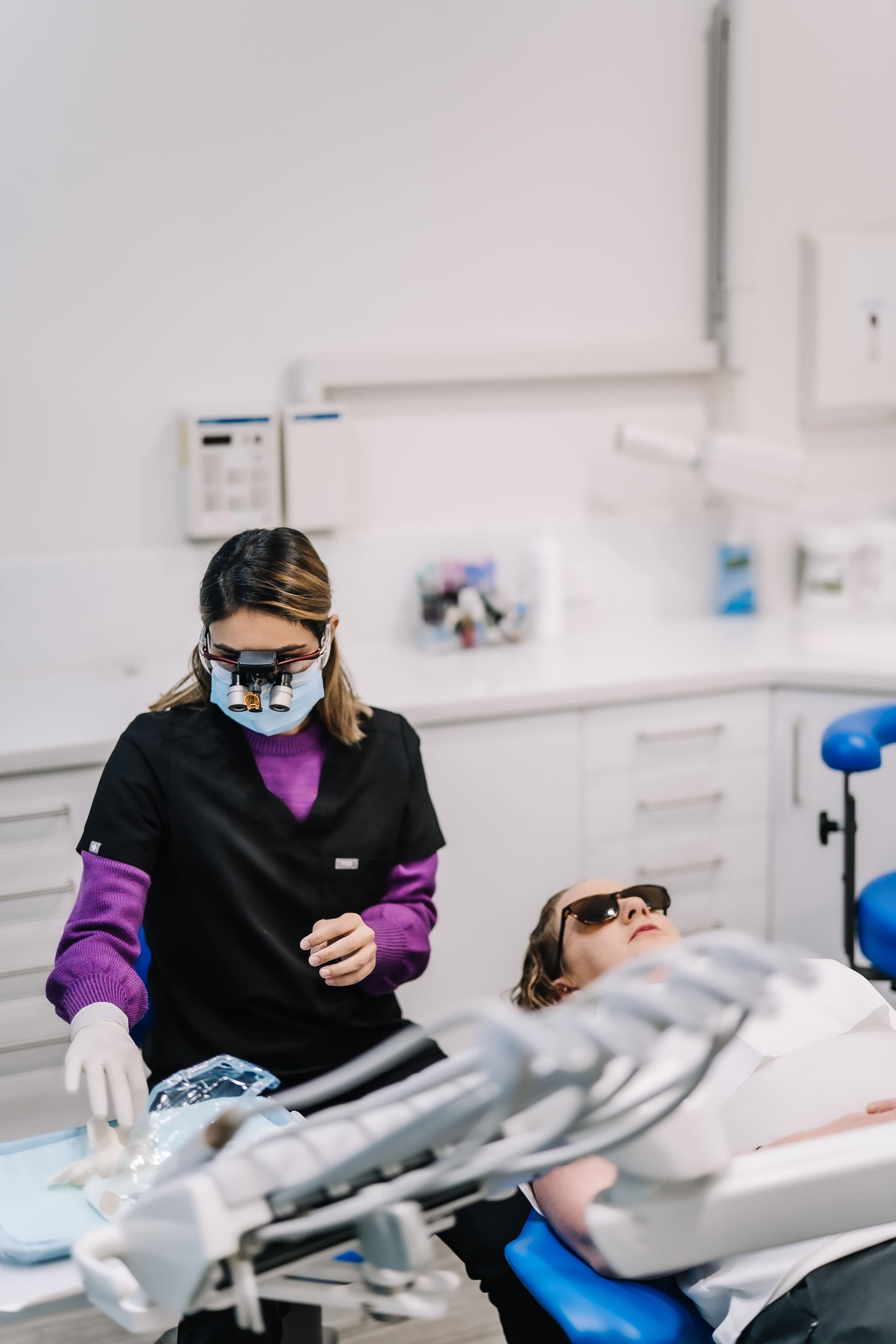 Dr Abhi Singh and Alefia Boxwala with a patient in the Sienna Smiles treatment room