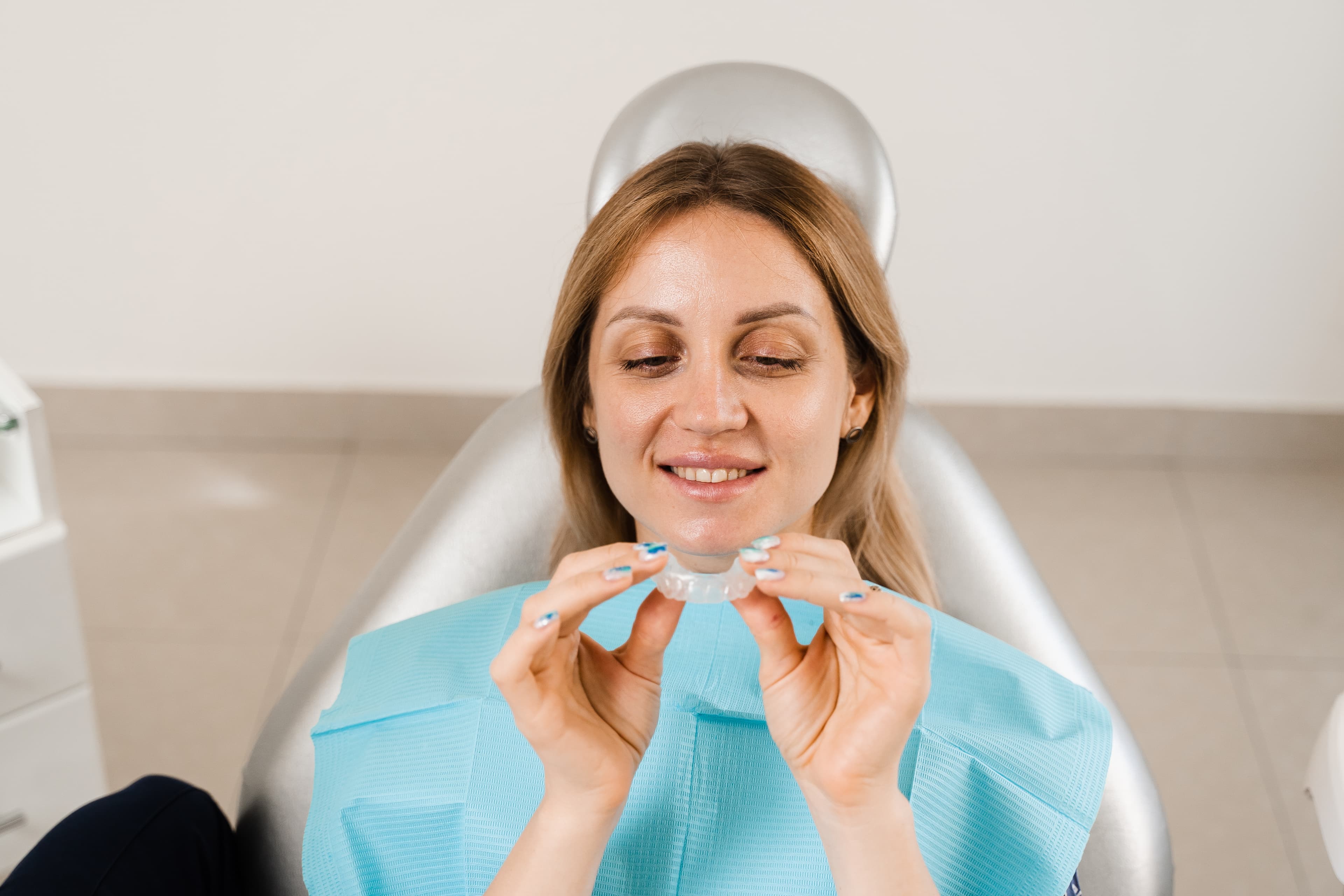 Clear Invisalign aligner tray being fitted by Dr Singh at Sienna Smiles, Hilbert